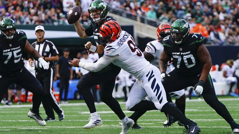 Cincinnati Bengals' Trey Hendrickson, second from right, tackles New York Jets quarterback Mike White during the second half of an NFL football game, Sunday, Oct. 31, 2021, in East Rutherford, N.J. (AP Photo/Frank Franklin II)