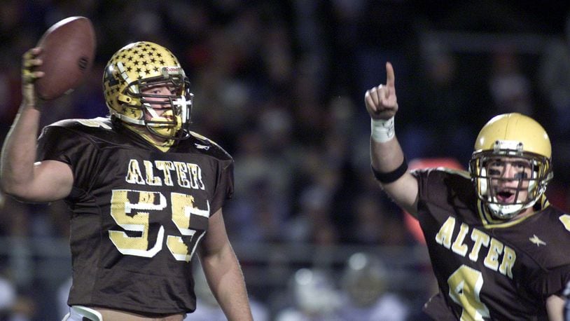 Nick Mangold (55) celebrates recovering a first quarter fumble with teammate John Sweeney. Alter played St. Francis Desles in a division III semifinal football game.