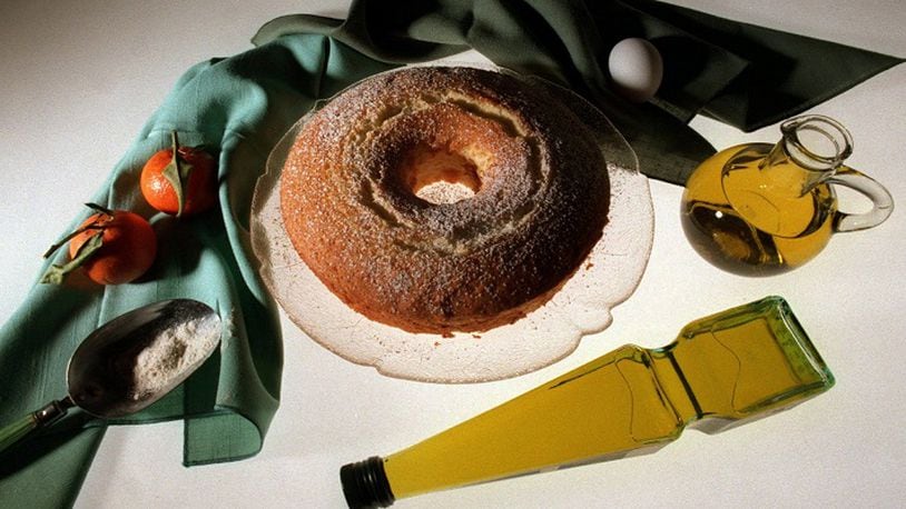 KRT FOOD STORY SLUGGED: OLIVEOIL KRT PHOTOGRAPH BY BARRY WONG/SEATTLE TIMES (KRT1-February  9)  Orange Chiffon Cake is as refreshing as it is light, even with a half cup of olive oil in the batter. Prompted by the popularity of Mediterranean cuisine, many recipes for baked goods are substituting olive oil for butter or margarine. In addition to tasting good, olive oil seems to be good for your heart, or at least better than certain other fats like butter. (SE) AP, PL (jak41556) 1998 (COLOR) NO MAGS, NO SALES