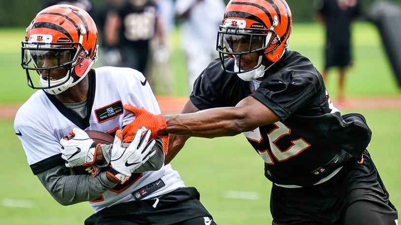 Bengals’ wide receiver John Ross catches a pass defended by cornerback William Jackson during organized team activities Tuesday, May 22 at the practice facility near Paul Brown Stadium in Cincinnati. NICK GRAHAM/STAFF