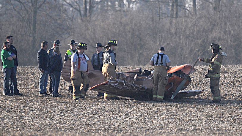 Emergency personel look over a single engine plane that crashed near Titus Road in Clark County Sunday evening. Marshall Gorby/Staff