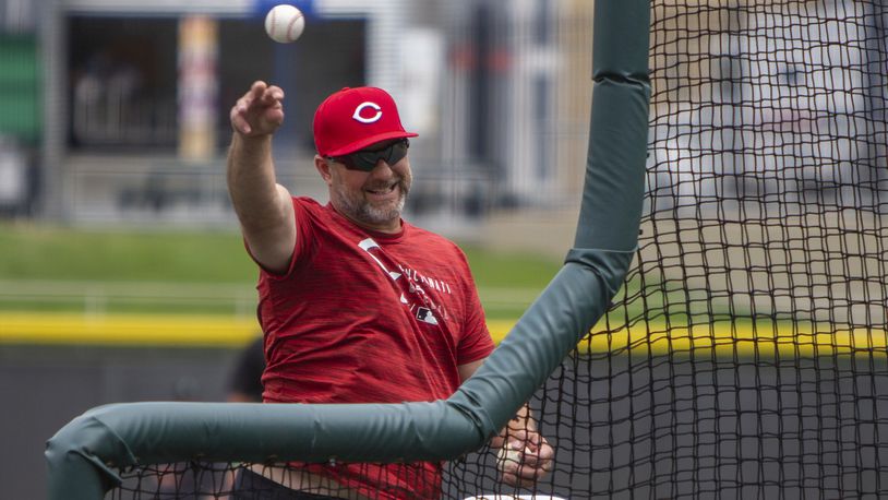 Reds minor-league hitting coordinator Dave Hansen throws batting practice for the Dragons at Dayair Ballpark on Thursday. Hansen is incorporating new technology into his coaching. CONTRiBUTED/Jeff Gilbert