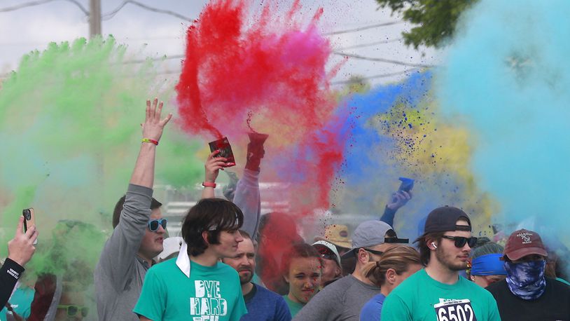 The seventh annual Dye Hard 5K starts with the air filled with colors Sunday, April 30, 2023 at the Clark County Fairgrounds. The Dye Hard 5K is a color run or walk event that raises money for the Developmental Disabilities Endowment Fund of the Springfield Foundation. More than 700 participants took part in the event with over 200 voluteers guiding racers where they need to go and throwing colored chalk on them as they run or walk past. BILL LACKEY/STAFF
