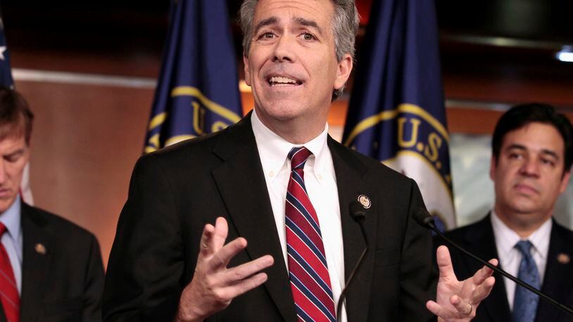 FILE - In this Nov. 15, 2011, file photo former U.S. Rep. Joe Walsh, R-Ill., gestures during a news conference on Capitol Hill in Washington. Walsh tweeted on Oct. 26, 2016, that he plans plans to grab his musket if GOP nominee Donald Trump loses the presidential election. Walsh later said on Twitter that he was referring to “acts of civil disobedience.” (AP Photo/Carolyn Kaster, File)