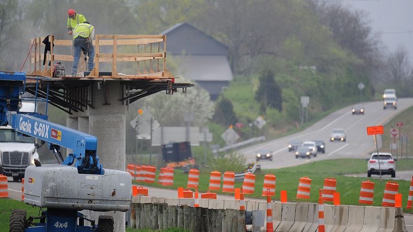 Crews work on replacing the state Route 235 Chambersburg Road bridge over state Route 4 in Huber Heights. MARSHALL GORBY\STAFF