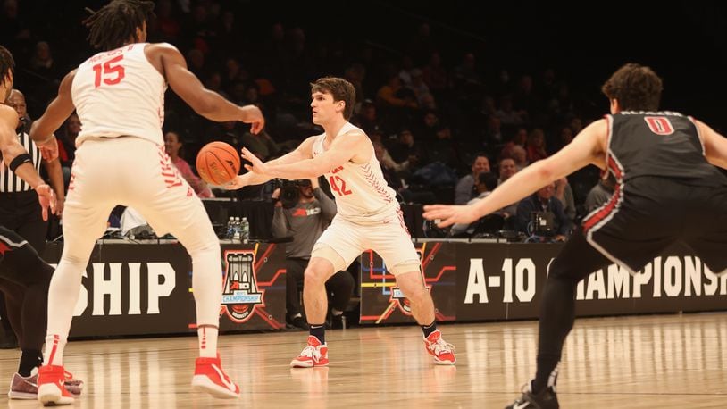 Dayton's Brady Uhl makes a pass against Saint Joseph’s in the quarterfinals of the Atlantic 10 Conference tournament on Thursday, March 9, 2023, at the Barclays Center in Brooklyn, N.Y. David Jablonski/Staff