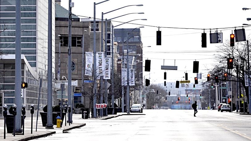 Violation of a mandatory stay-at-home order could result in fines, jail time or both. Due to the coronavirus, Second Street in downtown Dayton already appeared deserted Friday morning. MARSHALL GORBY / STAFF