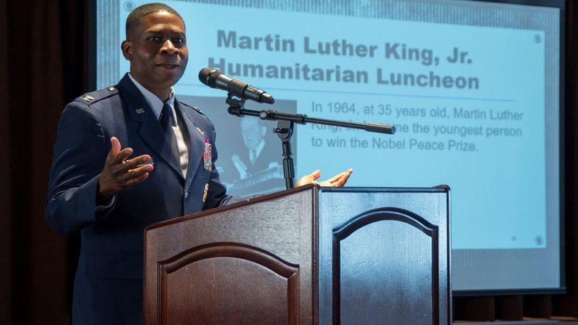 Col. Terrence Adams, Air Mobility Command director of communications and chief information officer, Scott AFB, Illinois, gives the keynote speech at the Dr. Martin Luther King Jr. Humanitarian Award Luncheon at Wright-Patterson Air Force Base Jan. 18. The luncheon recognized members of the Wright-Patt community who have made significant contributions to humanitarian causes locally and nationally. (U.S. Air Force photo/Richard Oriez)