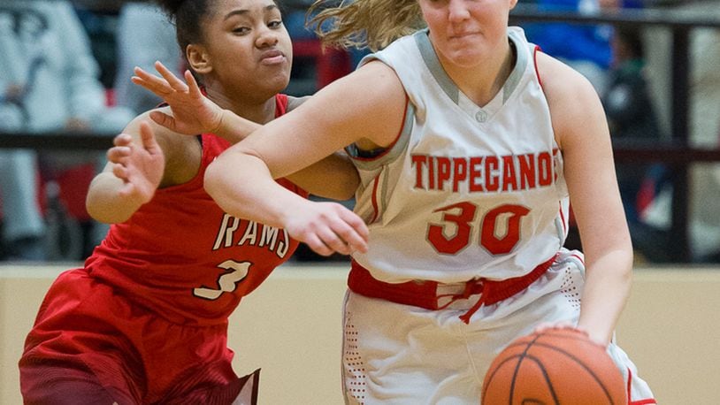 Tippecanoe junior guard Alison Mader dribbles with pressure from Trotwood’s Essence Thorton during a Division II sectional final on Saturday at Tecumseh. BRYANT BILLING / CONTRIBUTED
