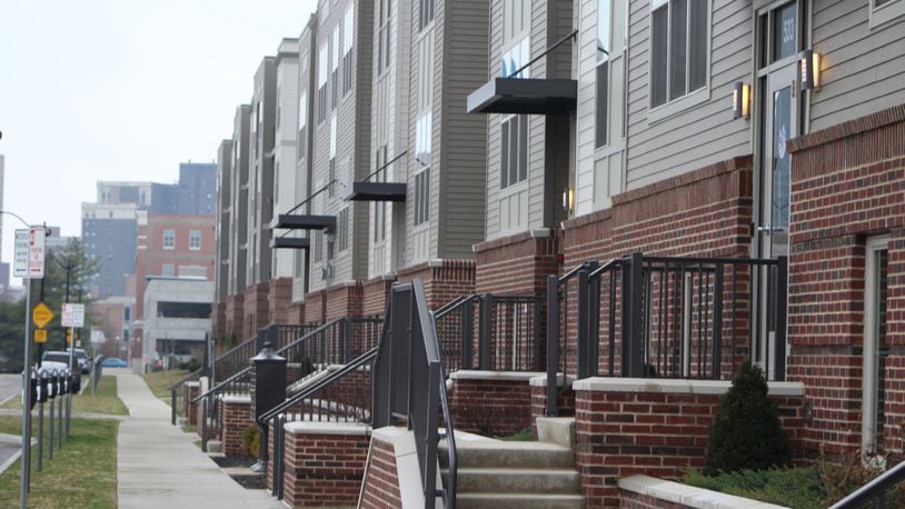 Dozens of new housing units are coming to the water front in downtown Dayton. They will be an extension of the Water Street Flats seen here. CORNELIUS FROLIK / STAFF