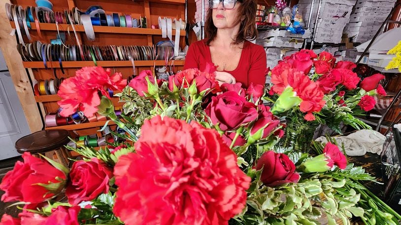 Sandy Simpson prepares Valentine's Day flower orders at Flowers By Roger Tuesday, Feb. 14, 2023 in Middletown. NICK GRAHAM/STAFF