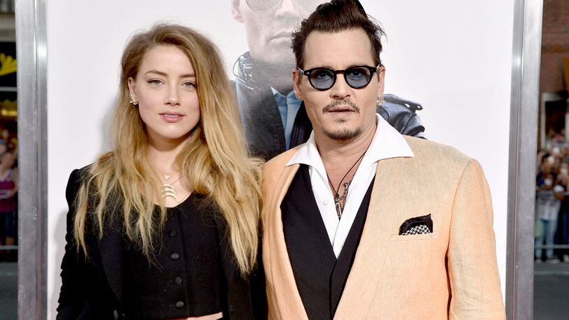 BOSTON, MA - SEPTEMBER 15: Actors Amber Heard (L) and Johnny Depp attend the "Black Mass" Boston special screening at the Coolidge Corner Theatre on September 15, 2015 in Boston, Massachusetts. (Photo by Paul Marotta/Getty Images for Warner Brothers)