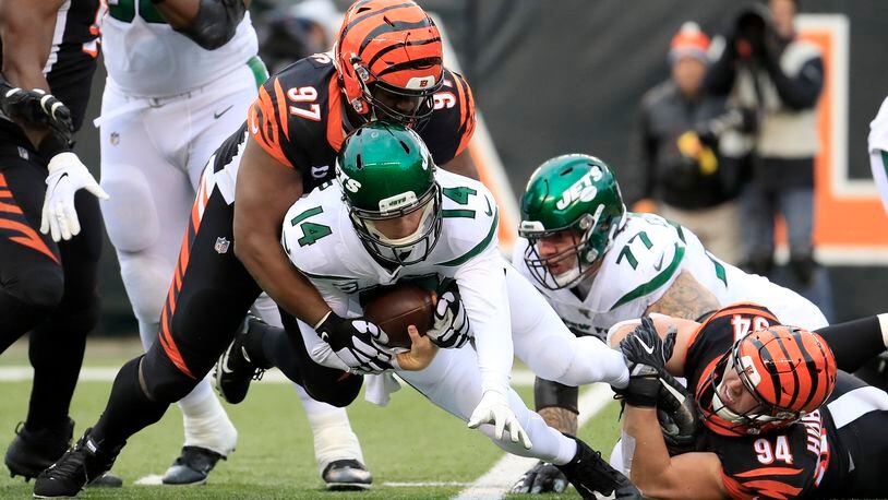 CINCINNATI, OHIO - DECEMBER 01: Sam Darnold #14 of the New York jets is sacked by Geno Atkins #97 and Sam Hubbard #94 of the Cincinnati Bengals at Paul Brown Stadium on December 01, 2019 in Cincinnati, Ohio. (Photo by Andy Lyons/Getty Images)