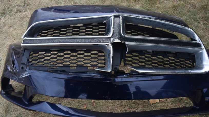A Dodge Charger involved in a serious-injury hit-and-run crash Sept. 23, 2023, on Harshman Road in Dayton left its front grille and bumper behind. CONTRIBUTED