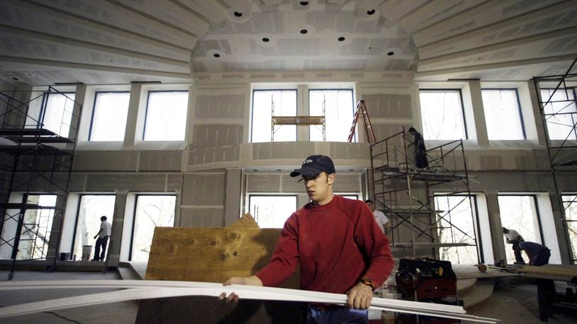 Scott Langenkamp, a worker with Brackett Builders in Troy, worked within the sanctuary of the Beth Abraham Synagogue on Sugar Camp Circle in Oakwood in this 2008 file photo. Staff photo by Chris Stewart