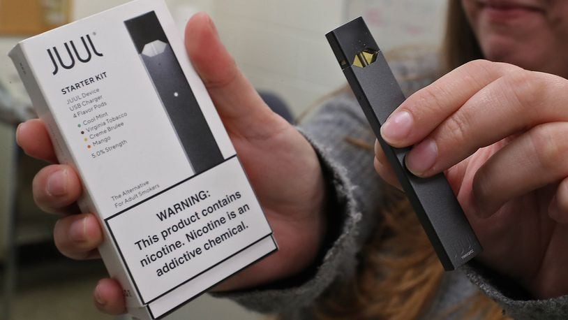 A Juul starter kit with a Juul device. BILL LACKEY/STAFF