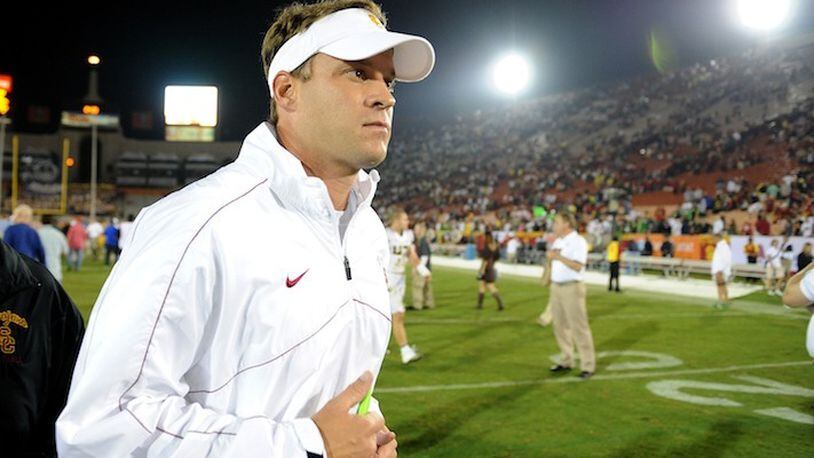 Lane Kiffin jogs off the field after losing to Oregon 62-51 at the Los Angeles Coliseum on November 3, 2012. (Wally Skalij/Los Angeles Times/TNS)