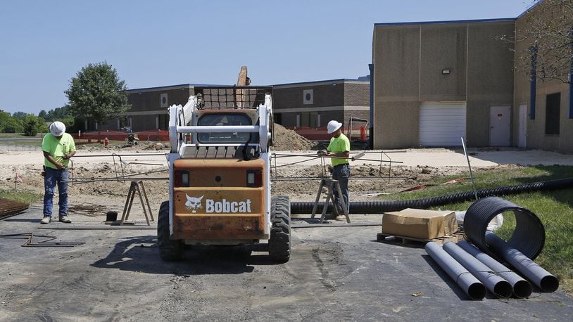 Contractors from WILCON, Corp. are working on an expansion of the fitness area at the Huber Heights YMCA. Workers on Friday were constructing rebar for the building foundation footers. TY GREENLEES / STAFF