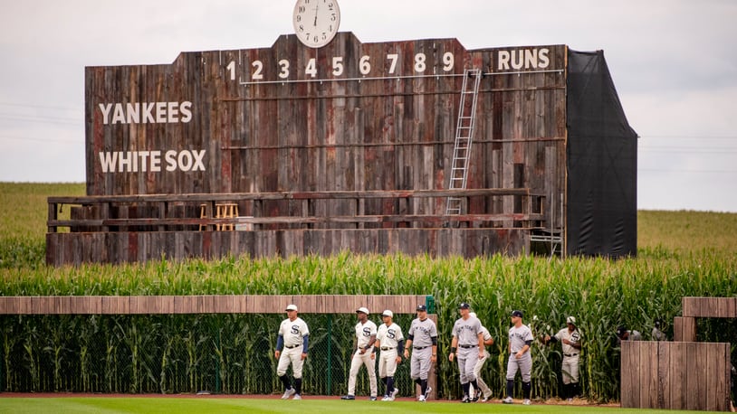In a nod to the movie, players for the New York Yankees and the Chicago White Sox entered the stadium through the cornfields ahead of Major League Baseball Field of Dreams game on Aug. 12, 2021 in Dyersville, Iowa, where a newly constructed 8,000 capacity stadium was built adjacent to the movie set field. (Johnny Milano/The New York Times)