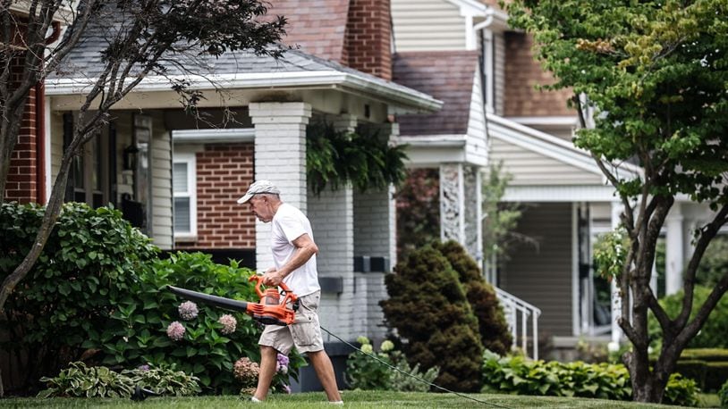 Bob Pack helps a friend with his lawn on Cushing Ave. in Kettering Thursday July 27, 2023. Most of the growth in residential value is in the southern part of county including Kettering at $987 million increase in property values. JIM NOELKER/STAFF