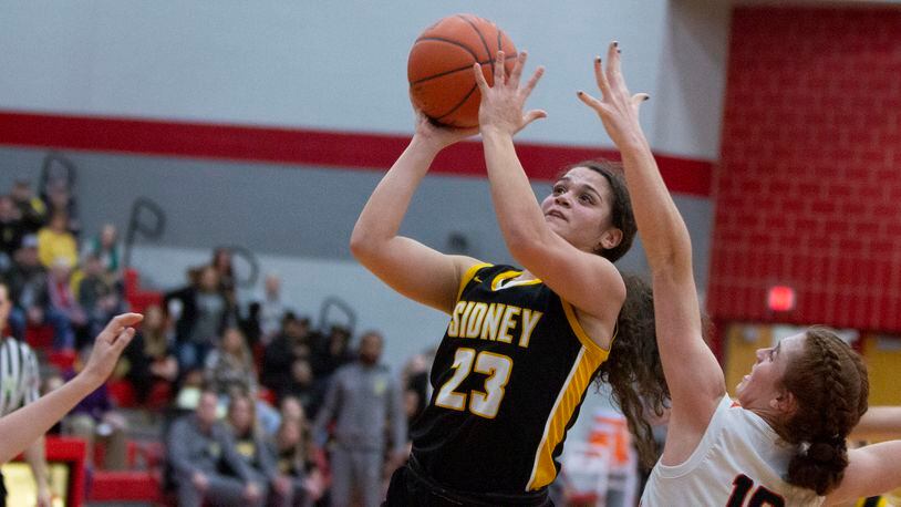 Sidney junior guard Allie Stockton shoots over Beavercreek's Lilli Leopard during the first half of Wednesday's Division I sectional game at Troy High School. Jeff Gilbert/CONTRIBUTED