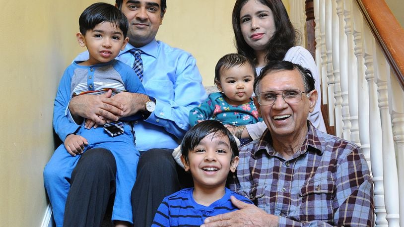 The Bhatti Household has three generations, top row, Rohaan, age 3, Rooshan, Romeesa, 7 months, Rabia. Bottom row, Roobash, 5 and Mohammad Bhatti, 76. MARSHALL GORBY\STAFF