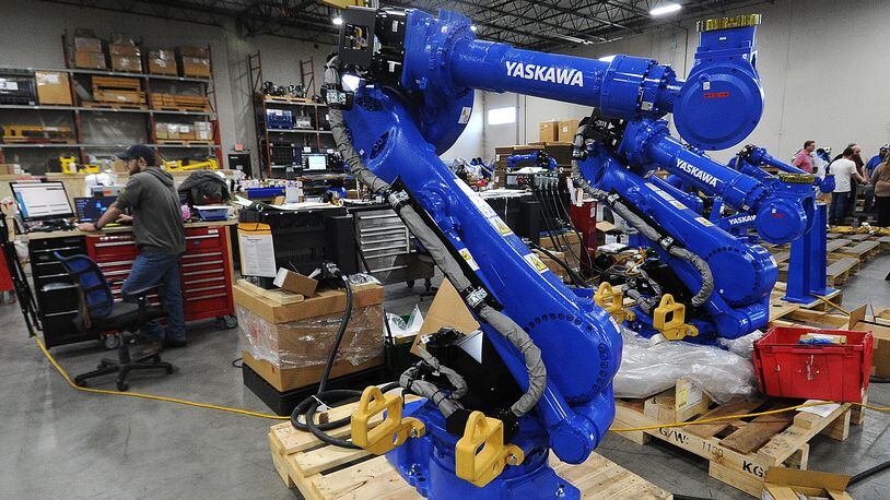 Inside the Yaskawa Motoman Miamisburg headquarters. The company is expanding its 305,000-square-foot Miamisburg headquarters by 185,000 square feet starting this month to accommodate the need for greater production at the facility, which opened in Miamisburg in 2011. MARSHALL GORBY\STAFF