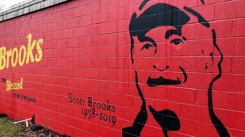 A mural honoring Scott Brooks adorns the wall of the sandwich shop he was the co-owner of.