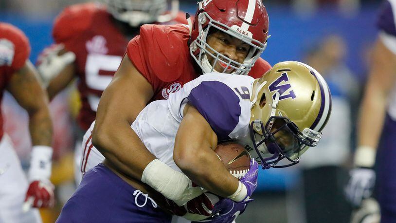 ATLANTA, GA - DECEMBER 31: Jonathan Allen #93 of the Alabama Crimson Tide tackles Myles Gaskin #9 of the Washington Huskies during the 2016 Chick-fil-A Peach Bowl at the Georgia Dome on December 31, 2016 in Atlanta, Georgia. (Photo by Kevin C. Cox/Getty Images)