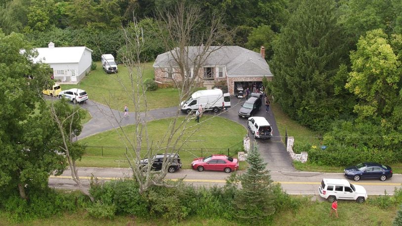 Investigators from the Ohio Bureau of Criminal Investigation searched property at 5531 Hemple Road in Moraine on Friday in connection with known missing persons. TY GREENLEES / STAFF