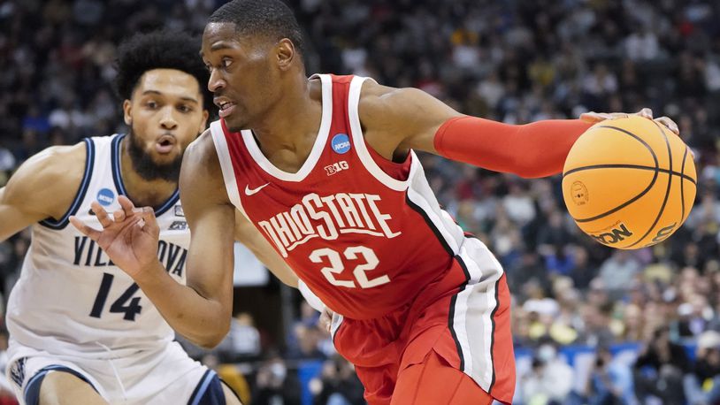 Ohio State's Malaki Branham (22) tries to get the ball past Villanova's Caleb Daniels (14) during the first half of a college basketball game in the second round of the NCAA tournament, Sunday, March 20, 2022, in Pittsburgh. (AP Photo/Keith Srakocic)