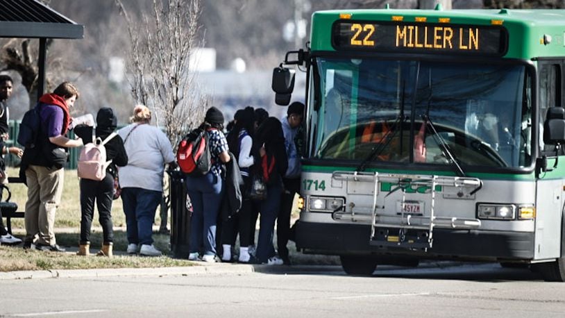 Students from Ponitz High School load onto an RTA bus on Edwin C. Moses Blvd. Thursday February 23, 2023. JIM NOELKER/STAFF