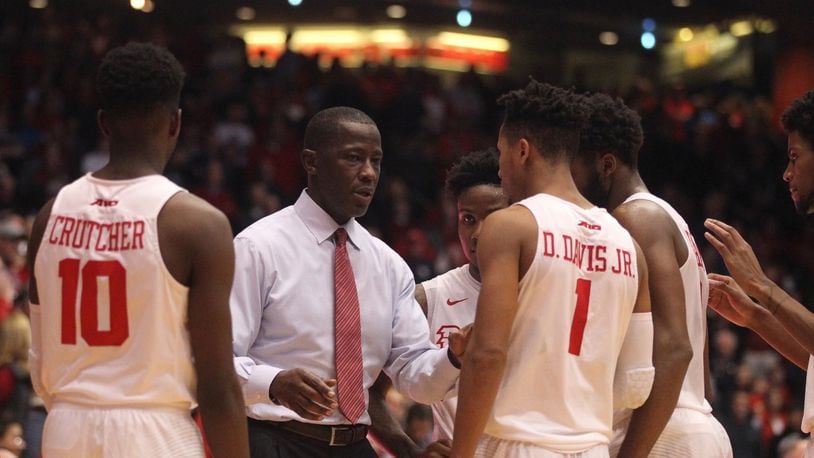 Dayton’s Anthony Grant talks to his players before the final shot against Ball State on Friday, Nov. 10, 2017, at UD Arena. David Jablonski/Staff
