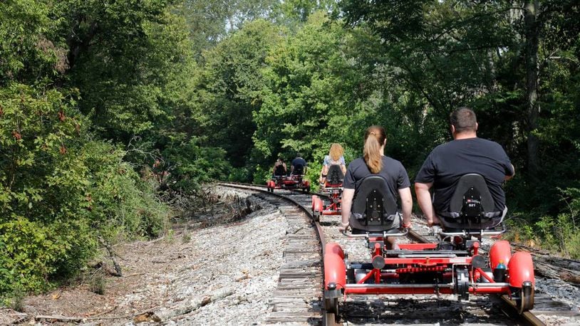 Visitors riding "Rail Explorers" pedal over train tracks in Versailles from the Bluegrass Scenic Railroad and Museum. (Olivia Anderson/Lexington Herald-Leader/TNS)