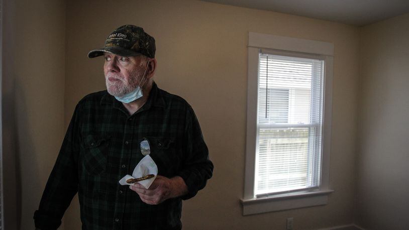 Vietnam War veteran Chris Johnson looks out of his rebuilt bedroom to his new shed in the backyard. Chris and his wife, Dorothy, will soon move back to the home that Habitat for Humanity fixed after it was heavily damaged by a 2019 Memorial Day tornado.