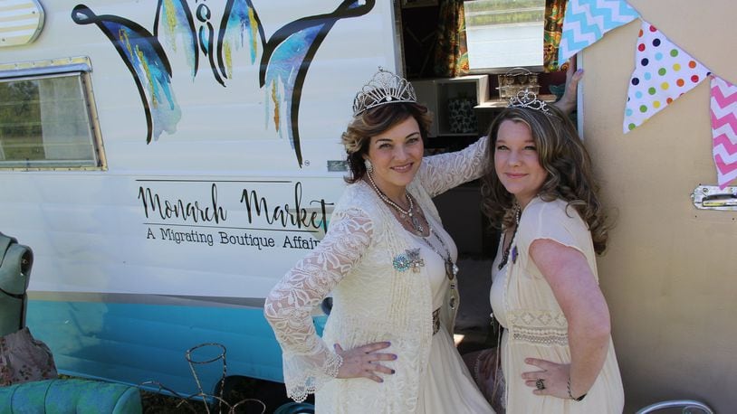Owner Marcie Brow, left, and Business Partner/Creative Director Ashley Smith outside their business-on-the-go RV for Monarch Markets. The business also has a brick-and-mortar building in downtown Springboro.