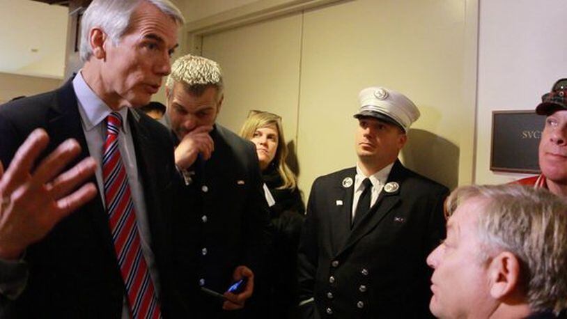 Sen. Rob Portman talks to 9/11 first responders and former Daily Show host Jon Stewart. PHOTO FROM HUFFINGTON POST