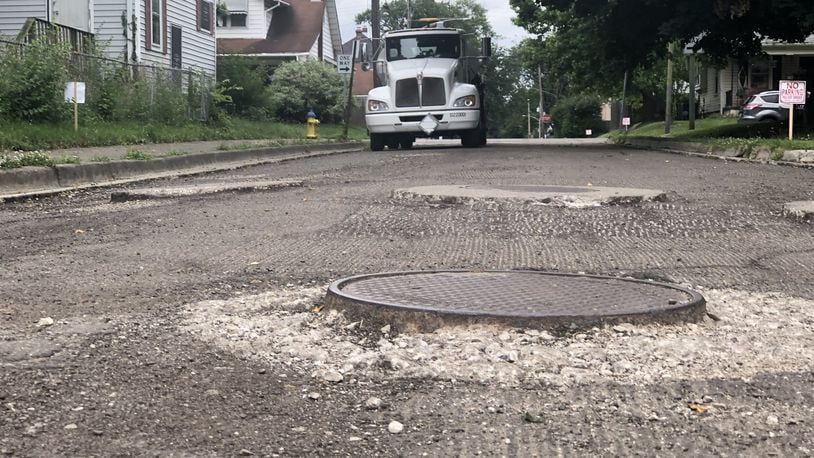 Muncie Street in Dayton’s Belmont neighborhood was grinded down in preparation to be repaved. A truck with A&B Asphalt was parked on the street. CORNELIUS FROLIK / STAFF