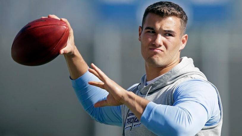 In this March 21, 2017, file photo, quarterback Mitch Trubisky passes during North Carolina's pro timing football day in Chapel Hill, N.C. (AP Photo/Gerry Broome, File)