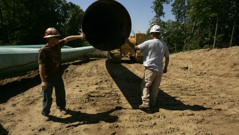 Swampers layout pipeline in 2008 in central Indiana that will eventually make it to Warren County. The 5 billion dollar project will move natural gas from the Rocky Mountains. Jim Noelker/Dayton Daily News
