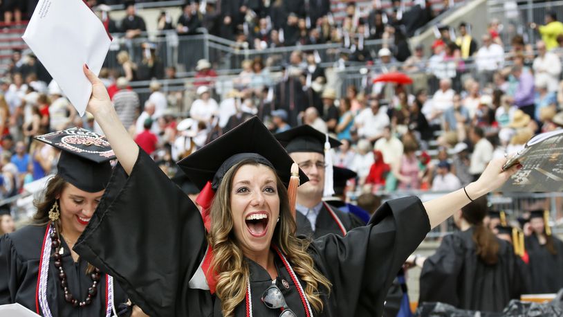 Holly Hazelton celebrates receiving her degree in Nursing as Ohio State University held commencement exercises for around 10,000 graduates on Sunday, May 10, 2015 at Ohio Stadium. (Dispatch Photo by Barbara J. Perenic)