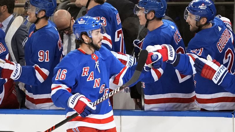 New York Rangers' Vincent Trocheck (16) celebrates with teammates after scoring a goal during the first period in Game 2 of an NHL hockey Stanley Cup first-round playoff series against the Washington Capitals, Tuesday, April 23, 2024, in New York. (AP Photo/Frank Franklin II)