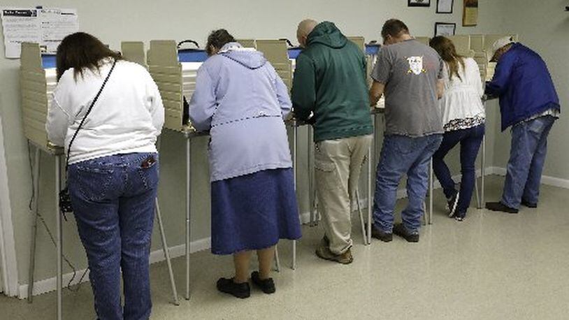 Miami County voters at the polls. BILL LACKEY/STAFF