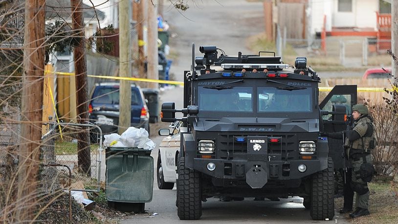 A SWAT standoff on East Third Street in Dayton ended after nearly seven hours with a man being taken into police custody. No injuries were reported during the standoff. MARSHALL GORBY\STAFF