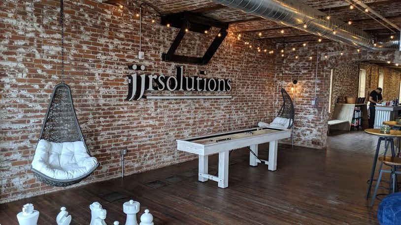 JJR Solutions has moved into renovated offices on East Third Street in downtown Dayton. The offices has exposed brick walls, original wood floors and a break room with games including oversized chess. CONTRIBUTED