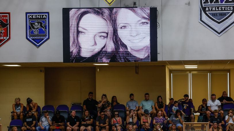 A photo of mother-daughter Kayla, 15, and Sarah, 41, Anderson who both lost their lives in the Butler Twp. shooting was displayed in the gym during the vigil Monday evening, Aug. 8, 2022, held at Butler High School. Also killed Friday morning on Hardwicke Place were neighbors Clyde and Eva "Sally" Knox. JIM NOELKER/STAFF