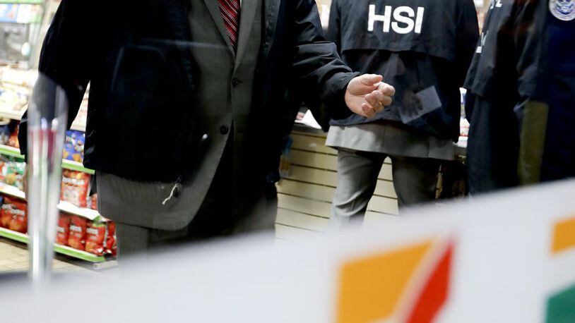 Christopher Kuemmerle, a group supervisor for U.S. immigration and Customs Enforcement’s Homeland Security Investigations unit watches as agents serve an employment audit notice at a 7-Eleven convenience store Wednesday, Jan. 10, 2018, in Los Angeles. Agents said they targeted about 100 7-Eleven stores nationwide Wednesday to open employment audits and interview workers. (AP Photo/Chris Carlson)