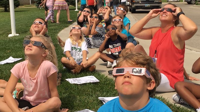 Horace Mann Elementary School students and teachers watch the solar eclipse at the Springfield school. Bill Lackey/Staff