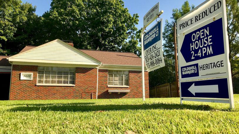 A sign outside a home at 3607 Poinciana Road in Middletown advertises for an open house earlier this year. Home sales through and including November are up nearly 1 percent in Butler County compared to the same time last year and the average price is up 5.7 percent. NICK GRAHAM/STAFF