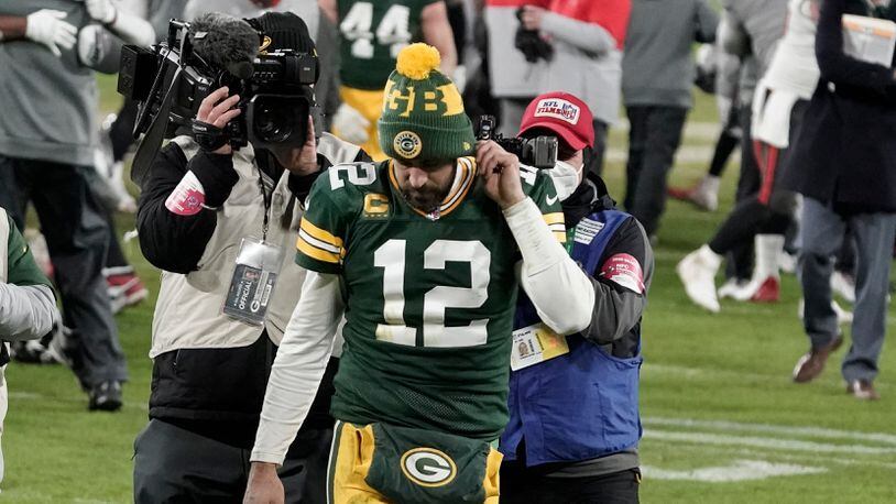 Green Bay Packers quarterback Aaron Rodgers (12) walks off the field after the NFC championship NFL football game against the Tampa Bay Buccaneers in Green Bay, Wis., Sunday, Jan. 24, 2021. The Buccaneers defeated the Packers 31-26 to advance to the Super Bowl. (AP Photo/Morry Gash)